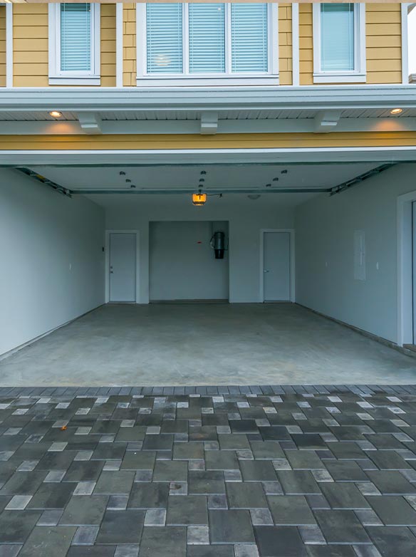 open garage door on yellow two story home